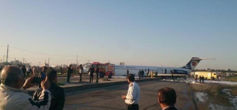 Iranian plane skids off runway, lands on a street