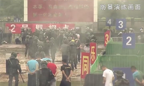 China warns protesters with slick military video