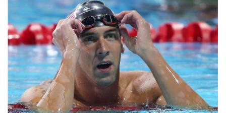 Swimming: Phelps glad to be back after 100m butterfly win