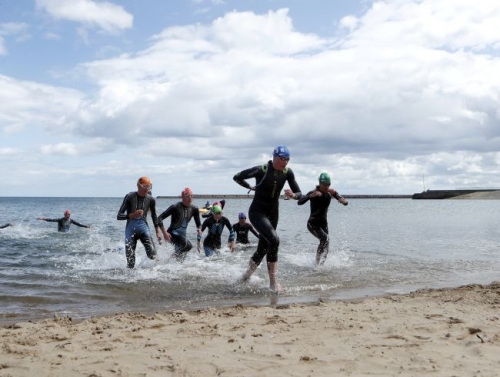 Dozens of swimmers fall ill after UK triathlon competition