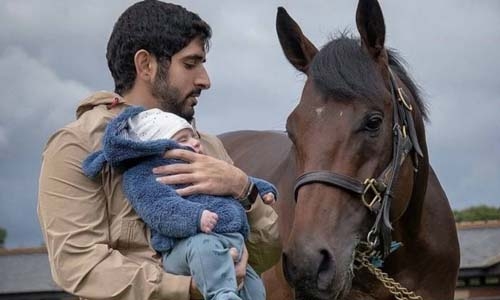 Sheikh Hamdan introduces 3-month-old twins to champion horse