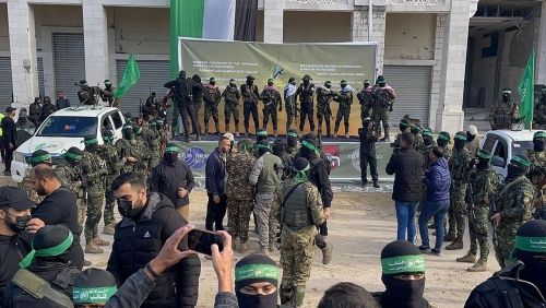 Dozens of Hamas fighters gather at key Gaza square for hostage handover