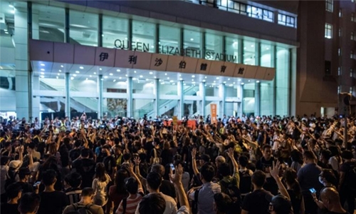 Hong Kong leader endures barrage of anger at town hall meeting