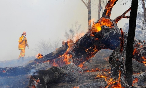 Scenes of bushfire-razed homes as Australia braces for more heatwaves