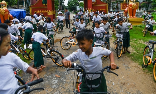 Ride on time: Recycled bikes get Myanmar kids to school