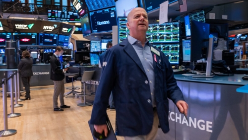 Stocks waver after hitting record highs