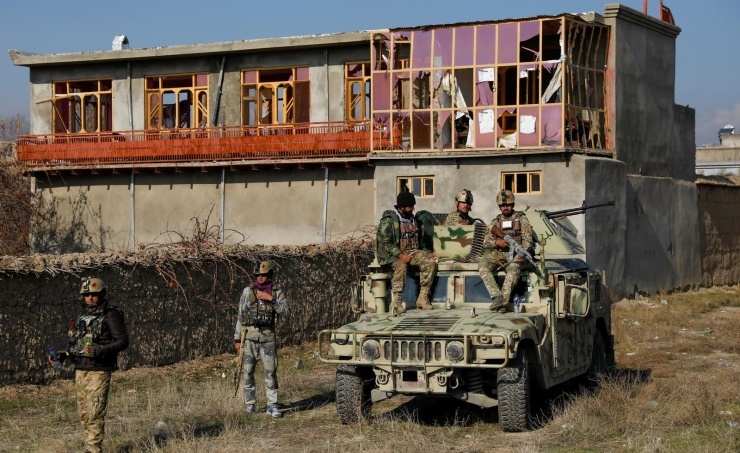 Afghan blasts kill one, injure scores in attack on key US military base