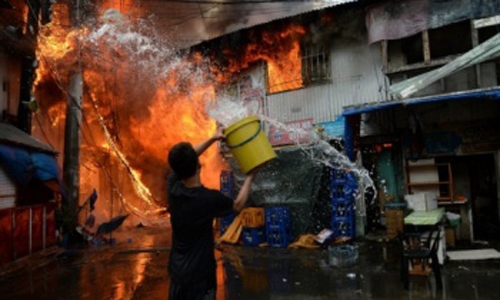 Manila slum inferno kills nine