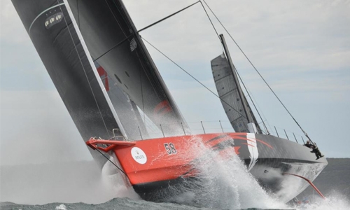 Damaged Comanche leads as wild weather forces boats out