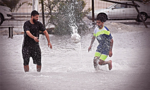 Bahraini youth have fun in heavy rain