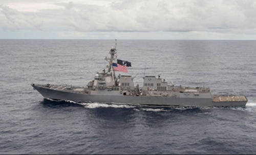 US warship sails by South China Sea reef, irking Beijing