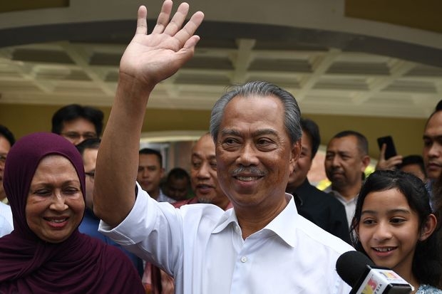 New Malaysia PM sworn, Mahathir fights on