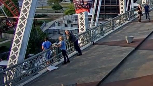 Jon Bon Jovi helps woman standing on edge of US bridge