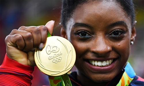 Biles bows out with four gold and name in lights