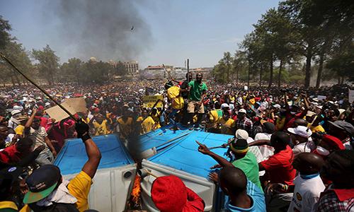 South African police and students clash at government buildings