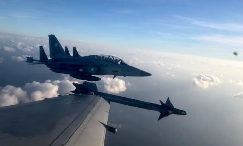 Philippines says China air force harassed its plane over disputed reef