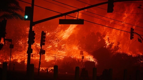 Hope Amid Flames: Firefighters Tame L.A. Wildfires, Brace for Winds