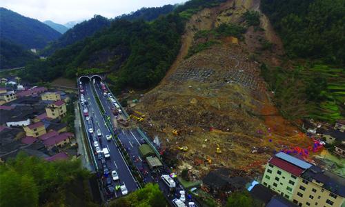 Flood-sparked landslide kills 16 in China