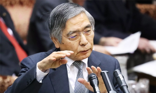 Japan keeps monetary easing as Fed hikes rates