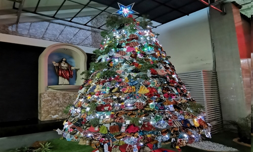 A Christmas tree decorated with masks, sanitisers to spread Covid awareness