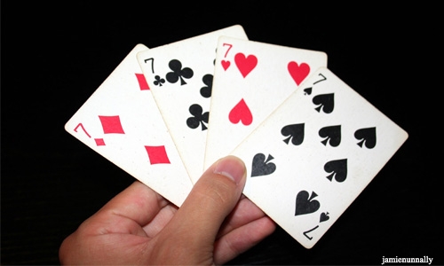 Teacher plays cards with students in class