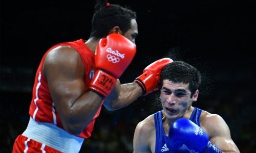 Lopez wins middleweight boxing title for third Cuban gold