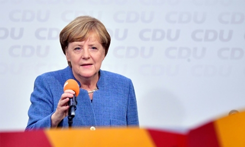 Vote winner Merkel faces tricky coalition talks, hard-right 'earthquake'