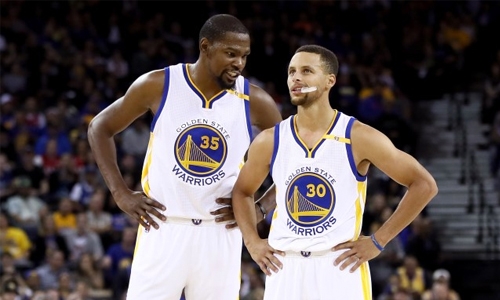 Curry, Durant fire Warriors over Raptors