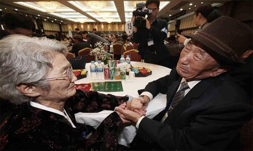 Shock, hugs and tears as war-divided Koreans reunite