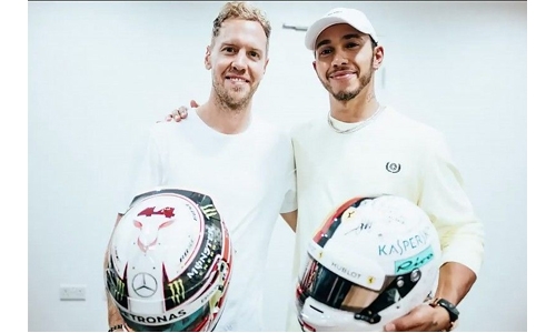 Foes Hamilton and Vettel swap helmets