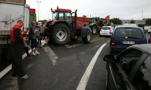 French farmers block roads in 'distress call' over low prices