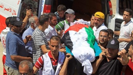 Palestinians bury second arson victim as accusations fly