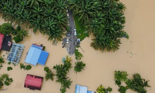 At least four dead, tens of thousands evacuated in Malaysia floods