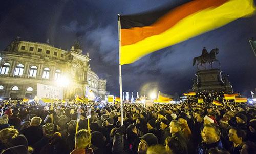 Thousands mass in Dresden for anti-migrant rally, counter-protest