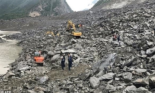 Two dead, 25 missing in China landslide