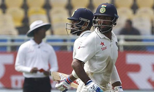 Kohli, Pujara tons give India opening day honours