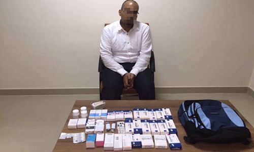 Pharmacist held with narcotic pills