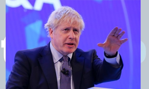 Britain’s Johnson drops corporate tax cut plan