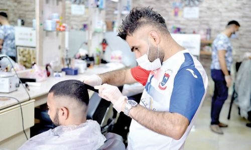 Barber shops keep blades busy, extend operating hours during Eid Al Adha holiday