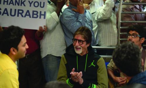 Amitabh Bachchan takes a local train ride in Mumbai, sings for charity 