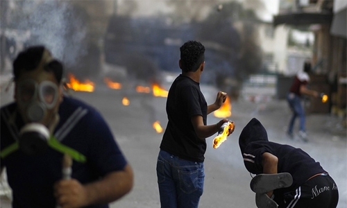 Bahrain jails six for arson