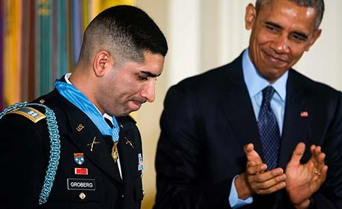 Obama awards 'hero' who tackled suicide bomber top military honour