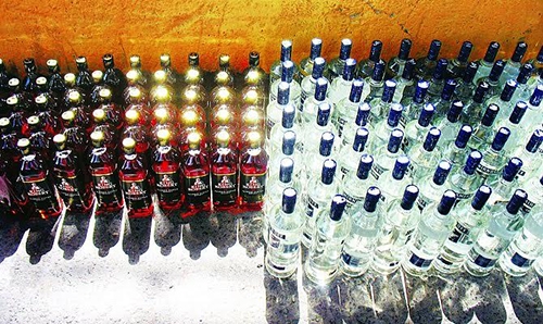 Saudi woman and driver caught smuggling liquor