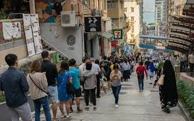 Record number of Hong Kong voters head to the polls in tense vote