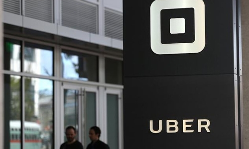 Uber head of finance leaving as company narrows losses