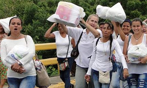 Venezuelans storm border with Colombia to stock up