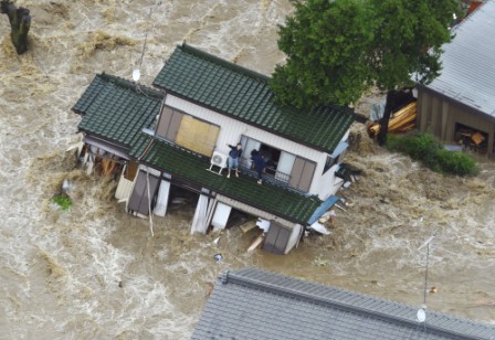Dozens trapped as floods sweep Japan
