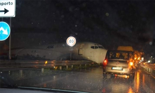  Cargo plane skids off runway, crashes on to road