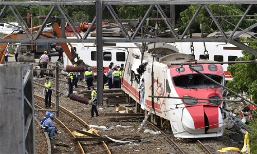 Taiwan probes train crash that killed 18