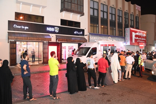 Customers withdraw new Eid Notes from NBB’s ATM Van